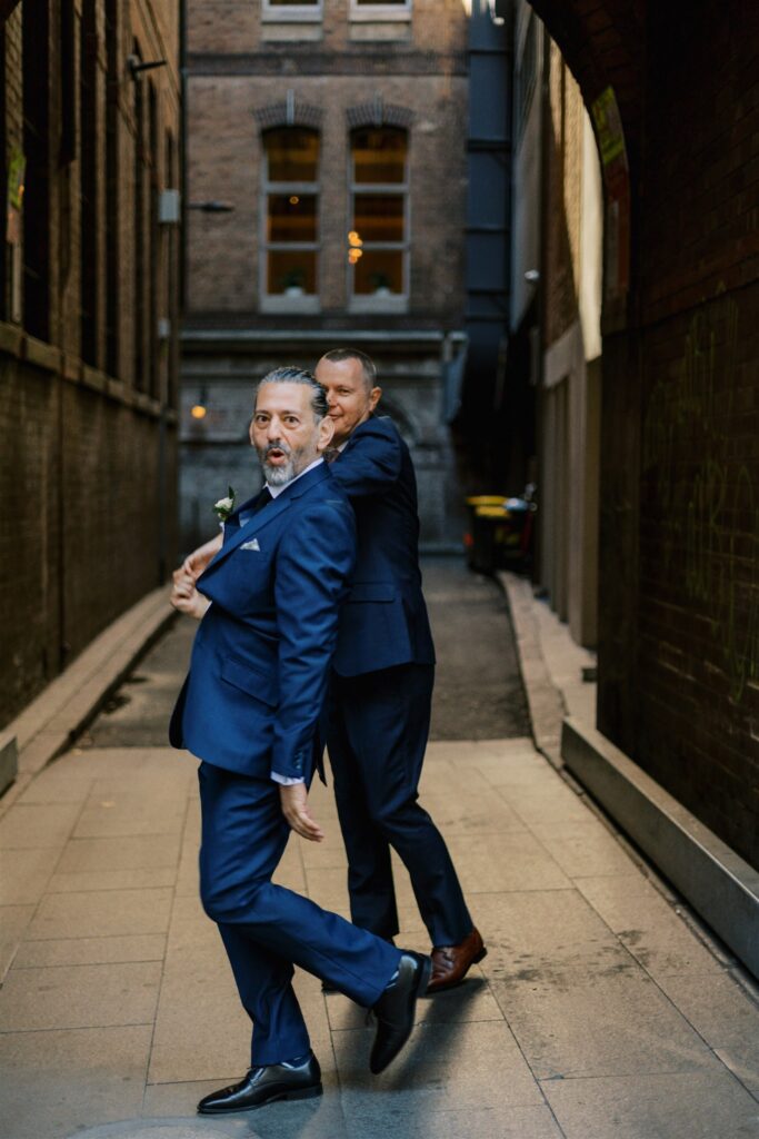 John and Jeff dancing in Sydney laneway on their wedding day
